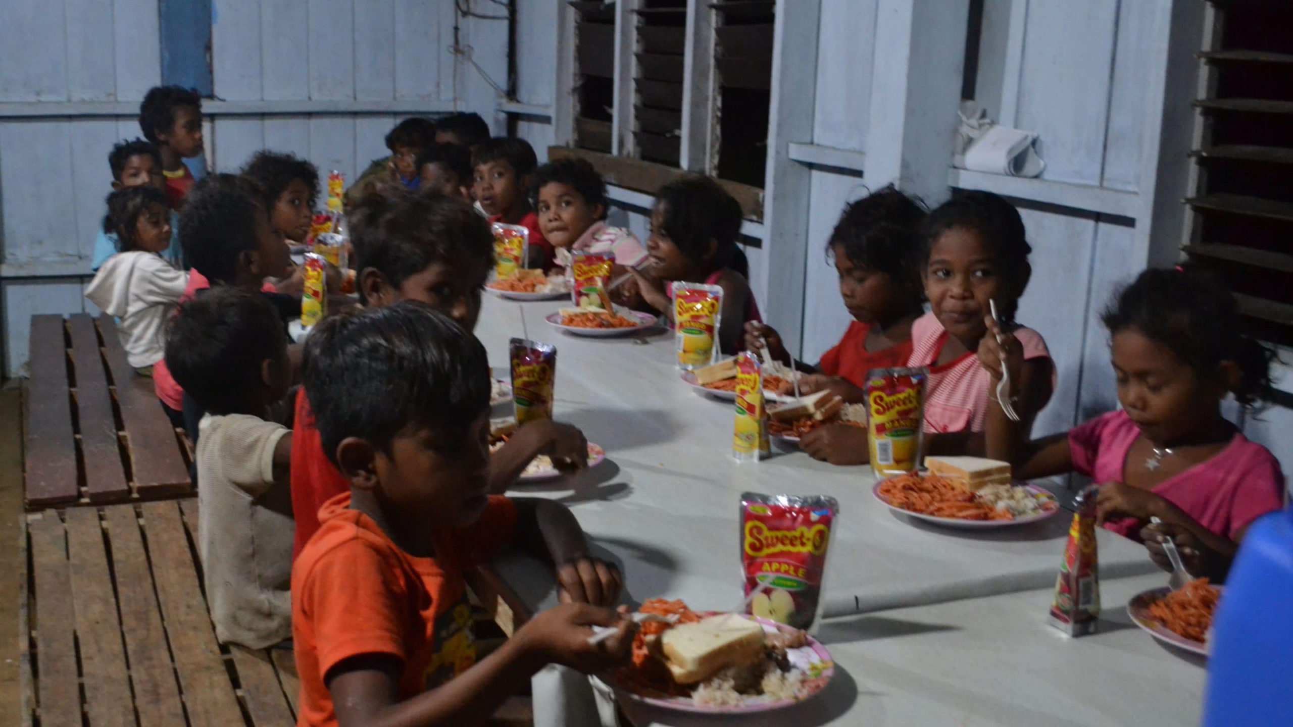 Kids eating Christmas dinner