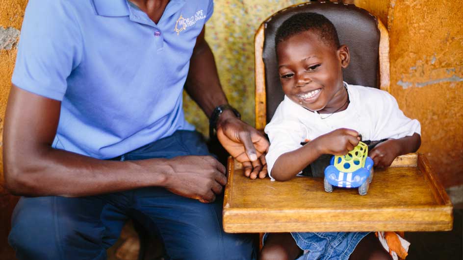 Young boy receiving therapy while in his highchair