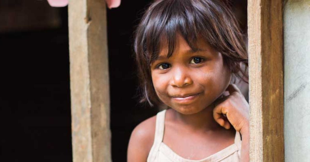 Filipino child looking out the window