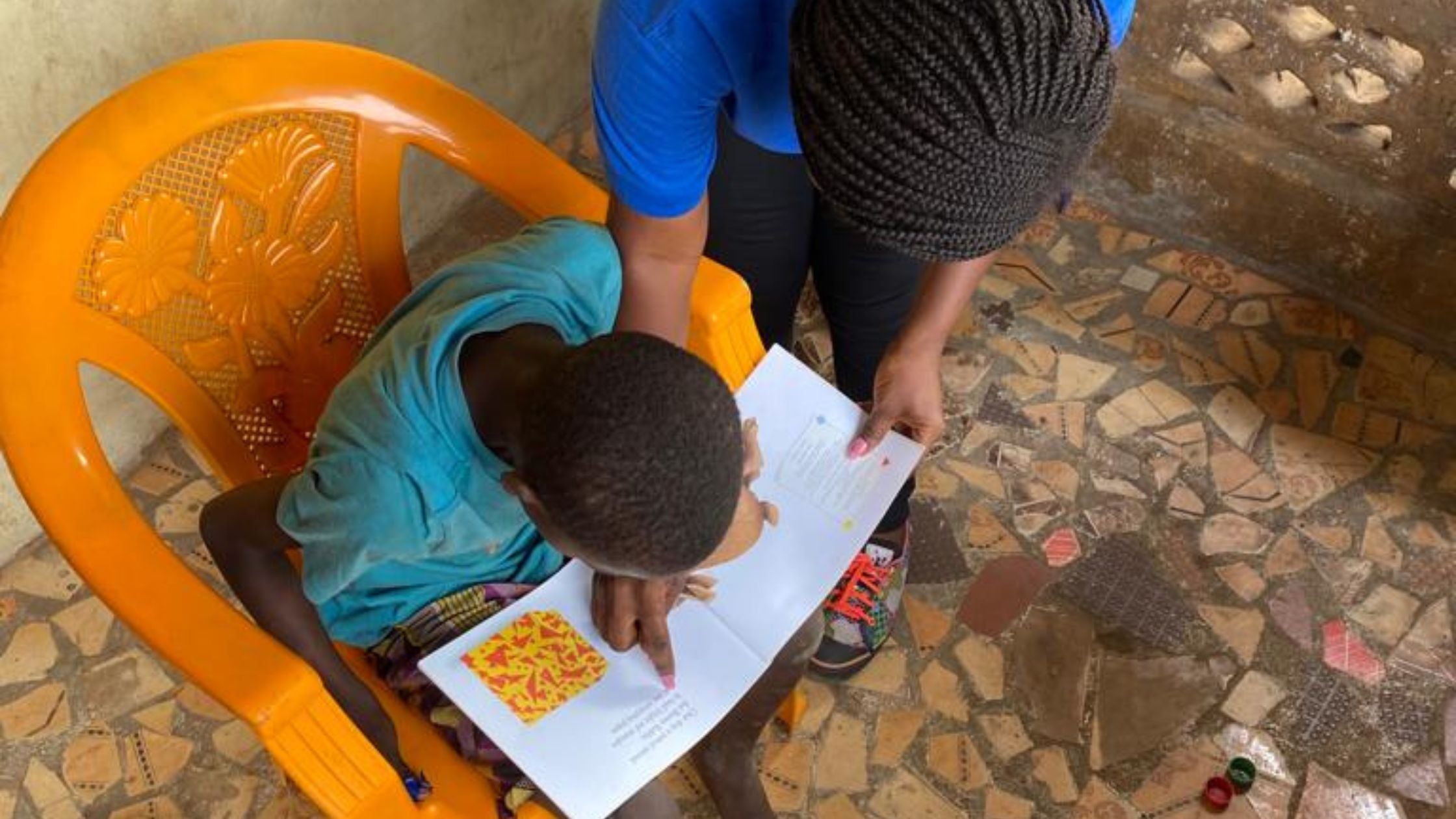 William reading with support worker