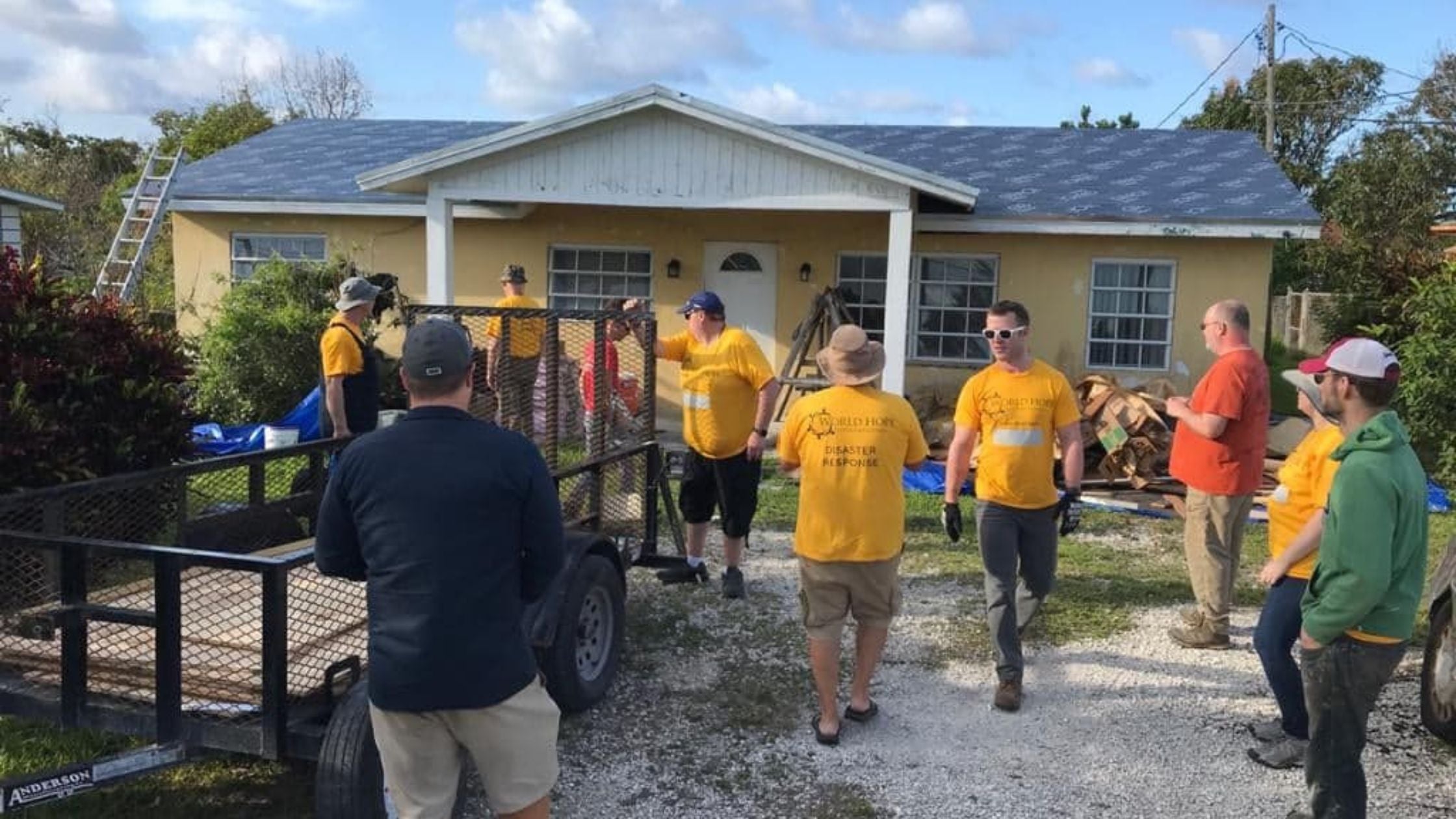 Volunteers helping rebuild a building in the Bahamas after Hurricane Dorian