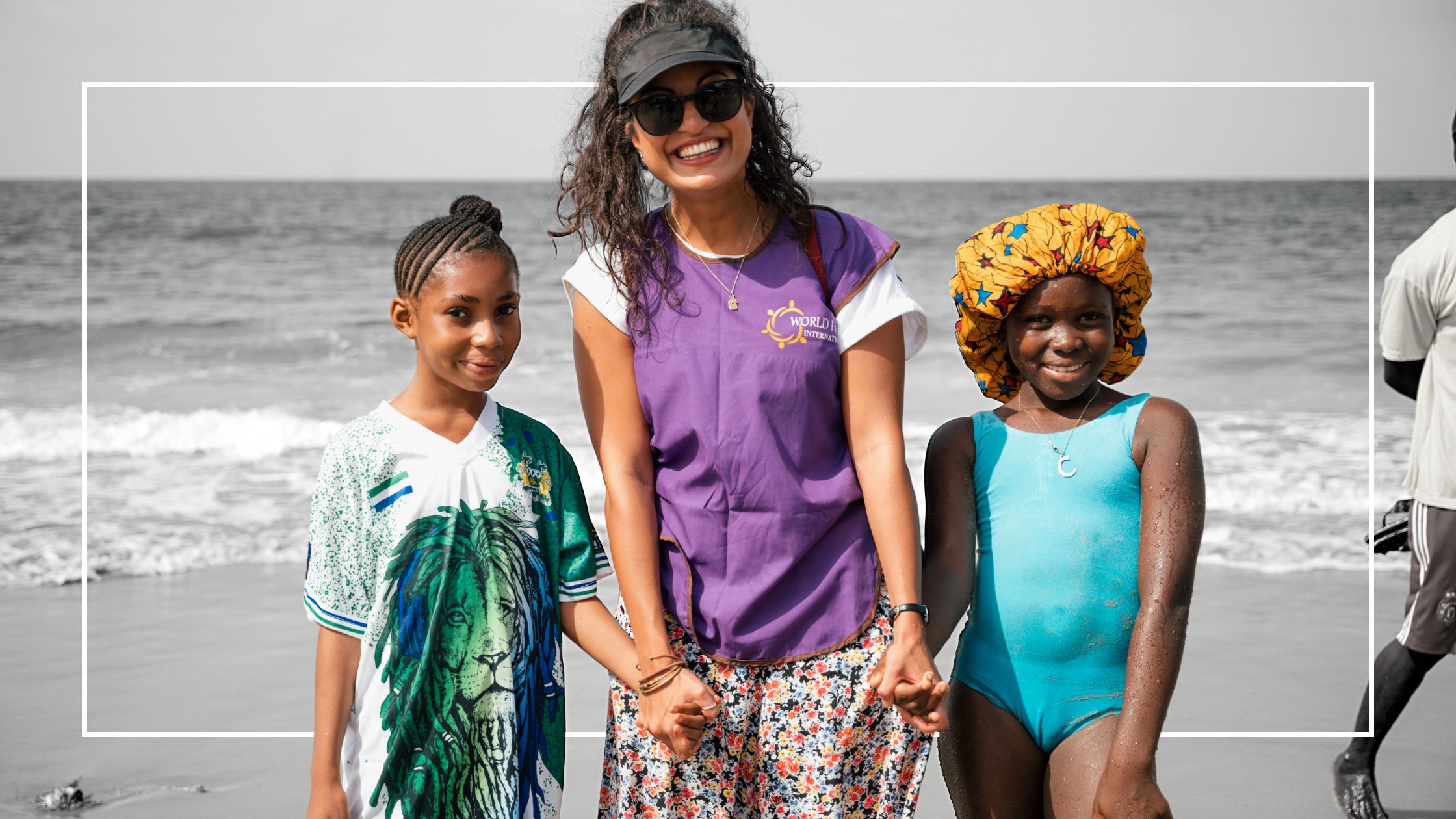 WHI ETC Employee with 2 girls at the beach in Sierra Leone