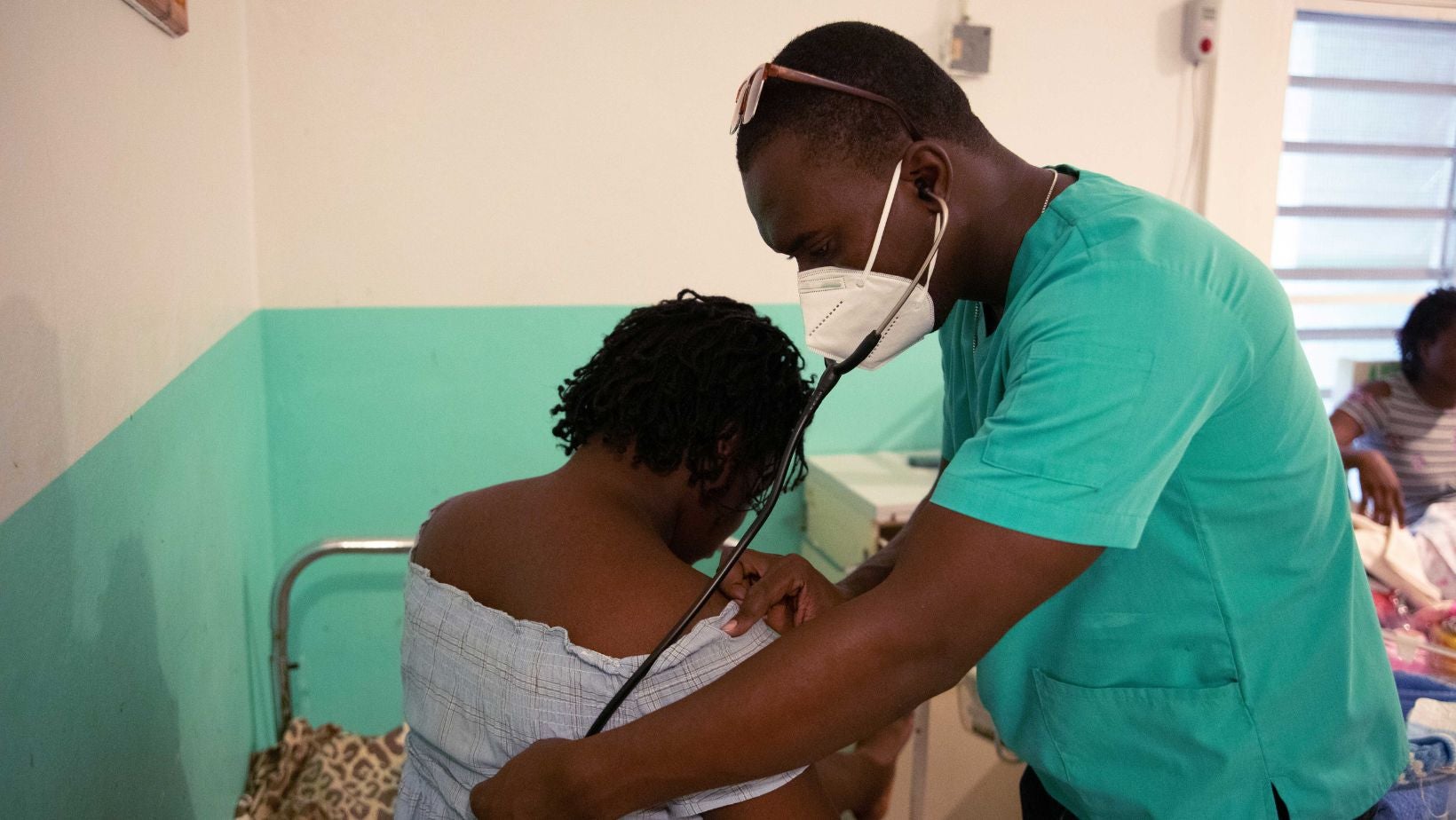 Doctor examining a patient at LaGonave Hospital