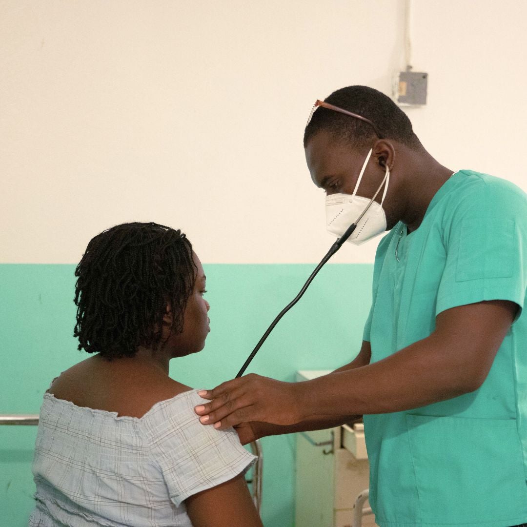 Doctor examining a patient at LaGonave Hospital