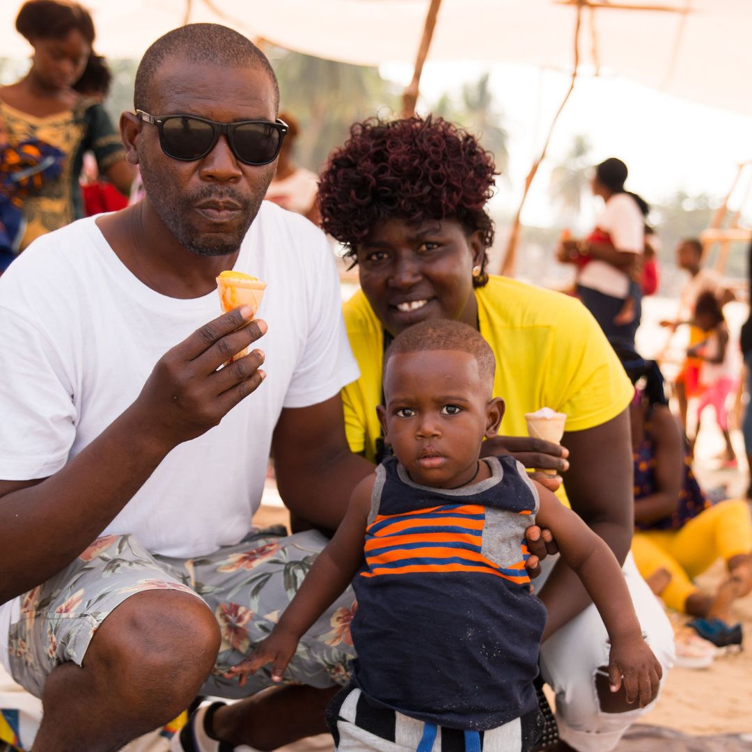 Family enjoying ice-cream at the ETC Beach Day in Sierra Leonne