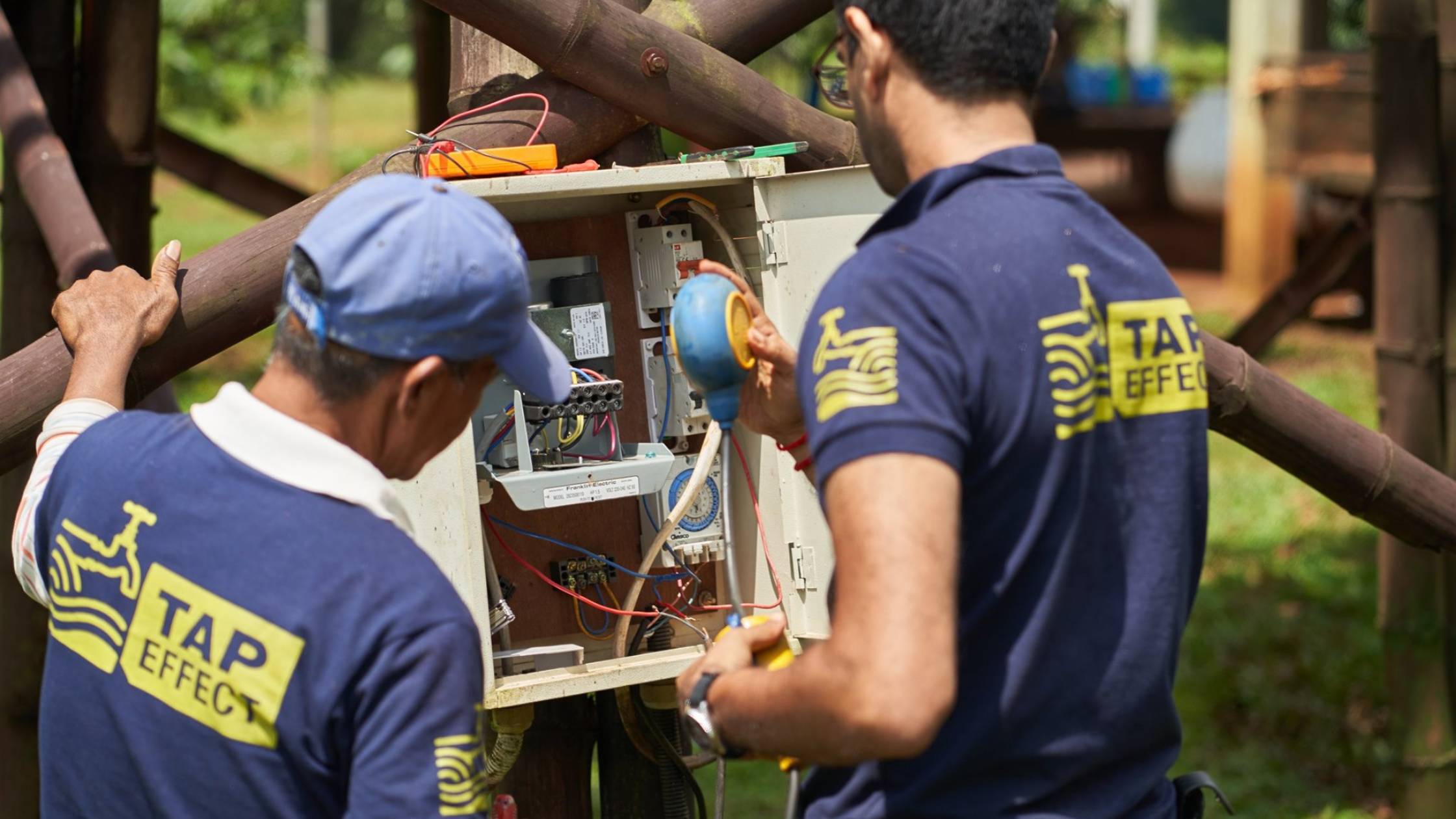 TapEffect employees checking water meter