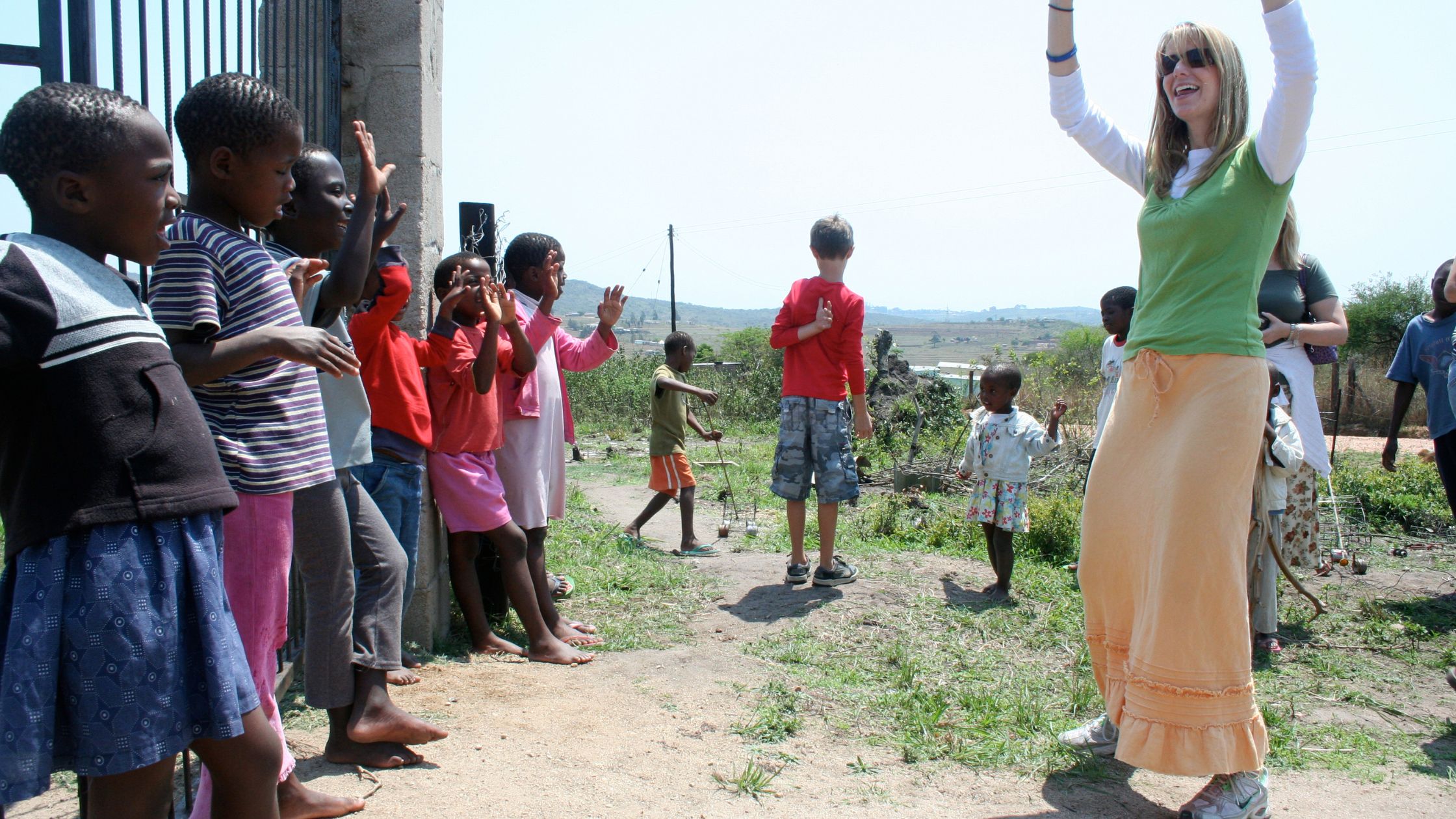 Leading with Hope: Jenn Pertersen playing with kids in Africa