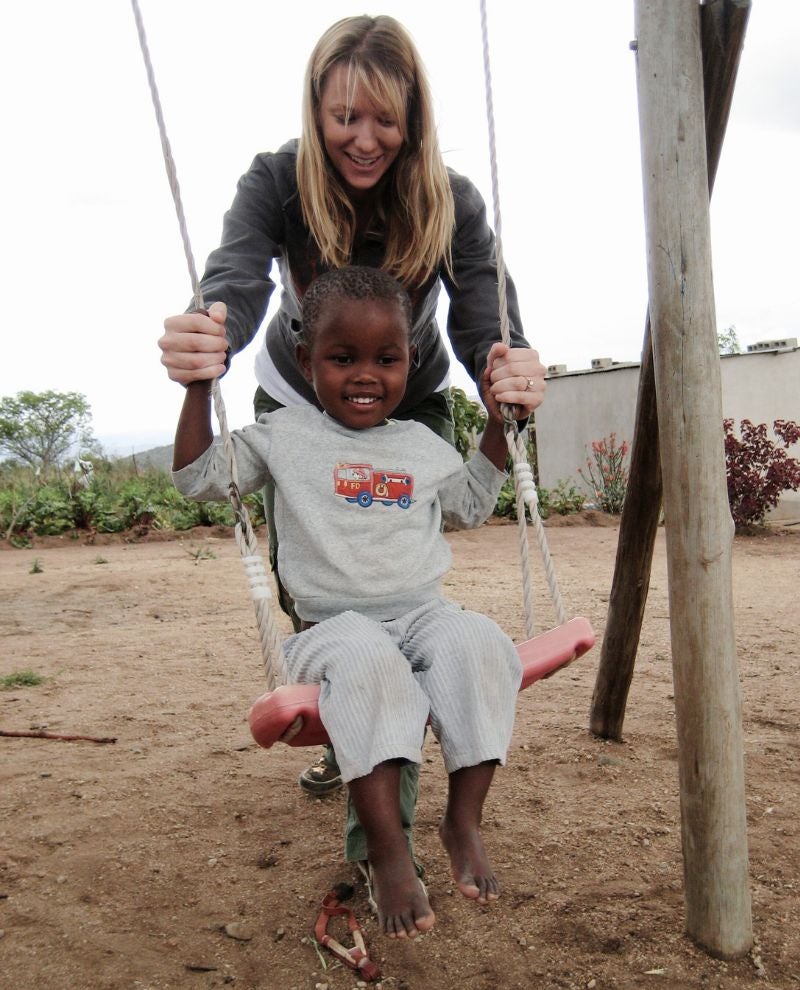 Jenn playing with a little girl