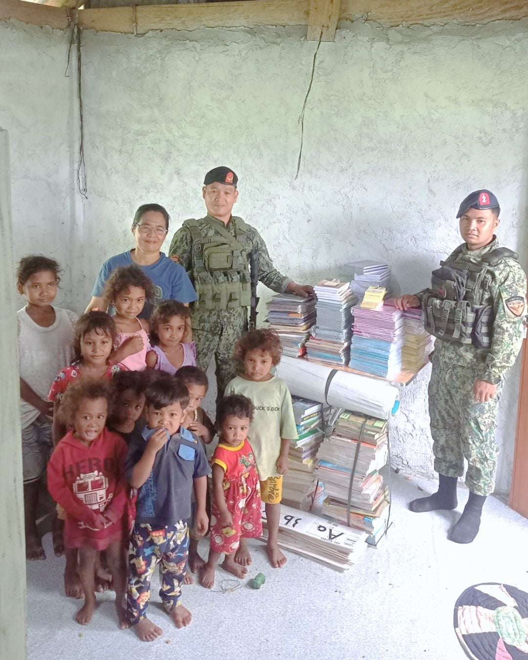 202nd Maneuver Company of the Philippine Army delivering books to the mini-library 202nd Maneuver Company of the Philippine Army delivering books to the mini-library