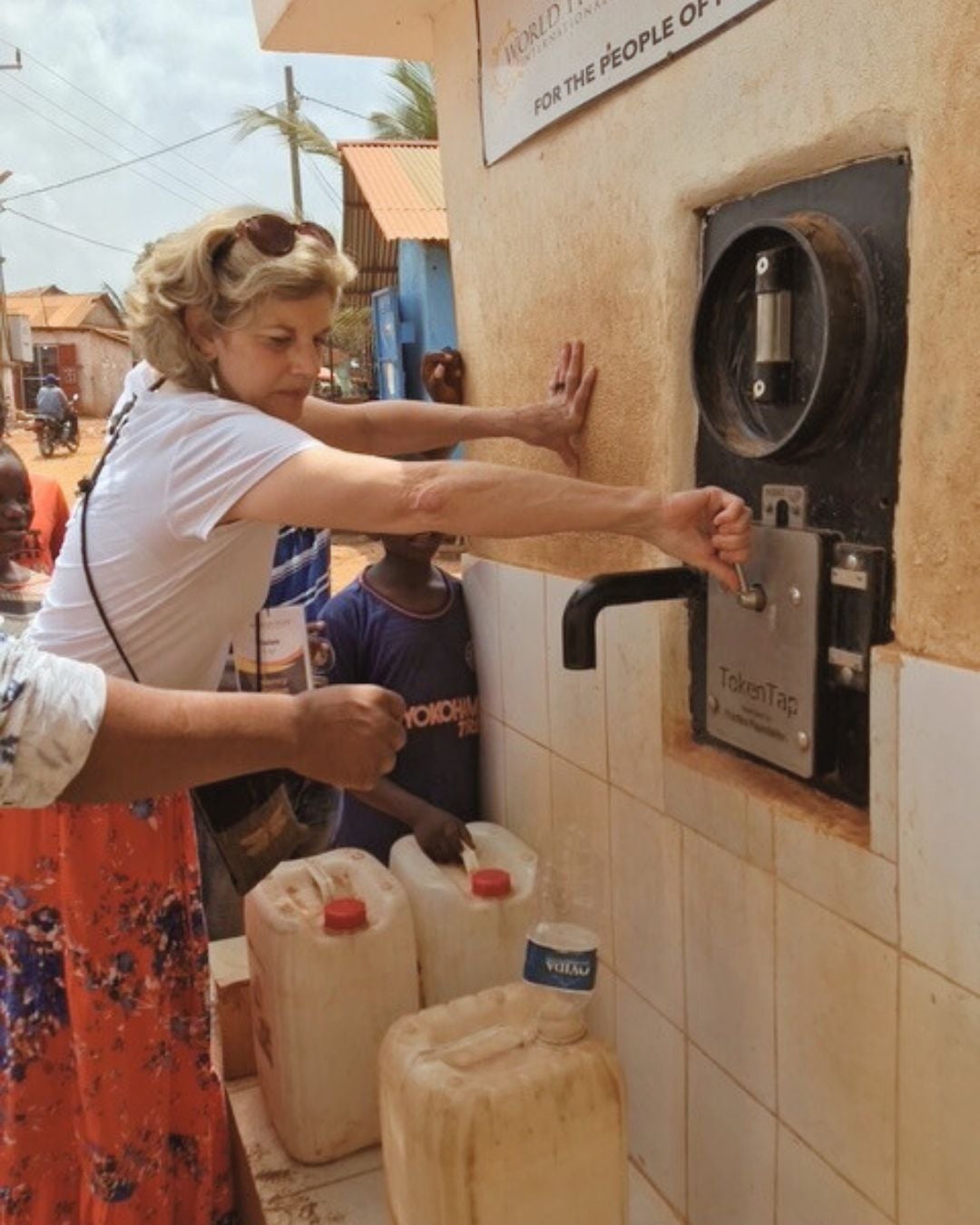 Nancy at water kiosk in West Africa